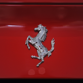 ferrari logo on red ferrari