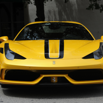 Yellow Ferrari with black stripe down the center