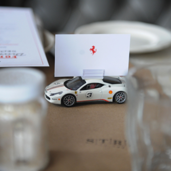 Ferrari scale model place setting at dinner