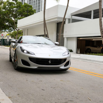 Silver Ferrari Portofino driving in Miami