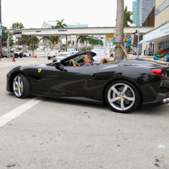 Giovanni Tosi driving black Ferrari Portofino in Miami